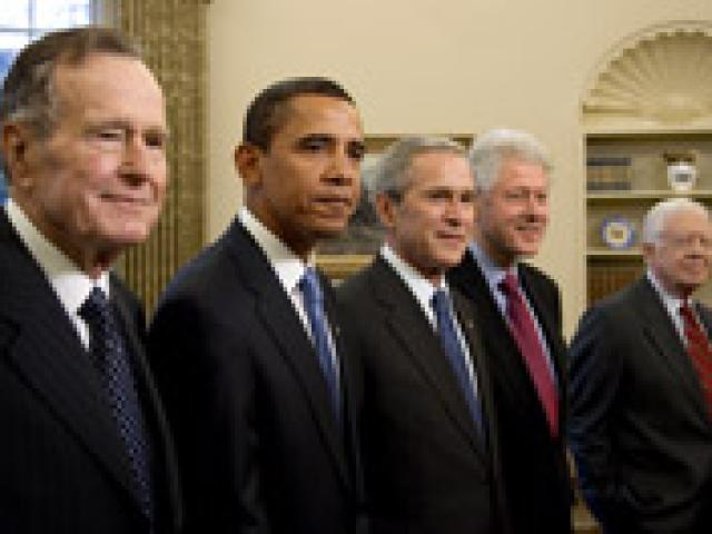 President George W. Bush stands with President-elect Barack Obama and former Presidents George H. W. Bush, Bill Clinton, and Jimmy Carter during their visit, January 7, 2009, in the Oval Office of the White House. (P010709JB-0343)