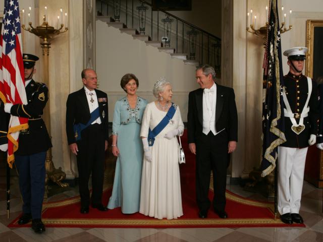 President George W. Bush and First Lady Laura Bush escort Her Majesty Queen Elizabeth II and His Royal Highness The Prince Philip, Duke of Edinburgh, from the Grand Staircase of the White House, May 7, 2007, prior to attending the State Dinner in the Queen's honor. (P050707JB-0692)