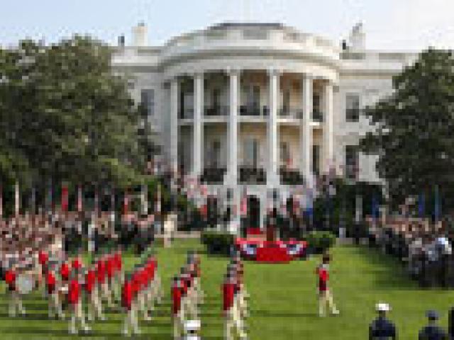 The U.S. Army Old Guard Fife and Drum Corps marches across the South Lawn during the official arrival ceremony for Prime Minister Junichiro Koizumi of Japan, June 29, 2006.