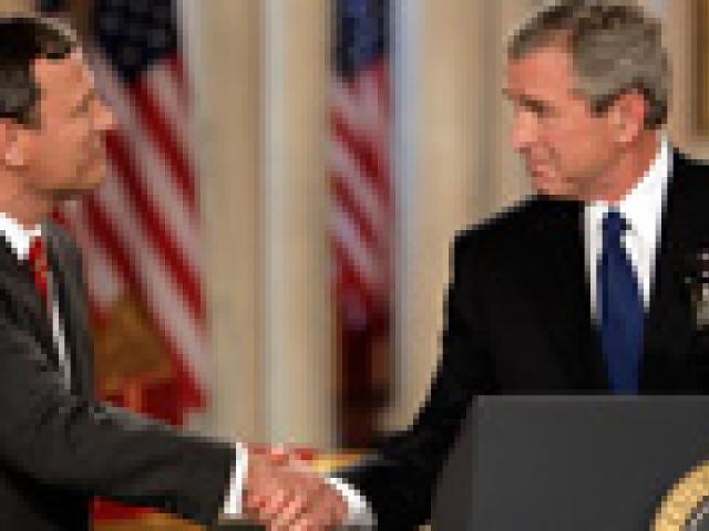 President George W. Bush shakes hands with Supreme Court Justice Nominee John Roberts after his remarks on the State Floor of the White House, July 19, 2005.