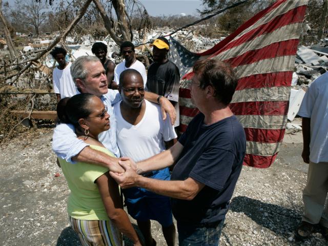 President George W. Bush embraces victims of Hurricane Katrina September 2, 2005, during his tour of the Biloxi, Mississippi, area. (P090205ED-0726)