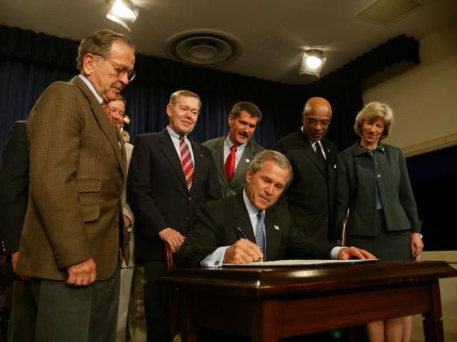 President George W. Bush signs into effect the Indian Education Executive Order during a signing ceremony, April 30, 2004, in the Old Executive Office Building. (P40117-10)