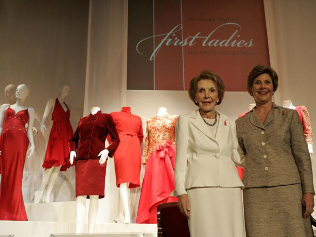 Mrs. Laura Bush and Mrs. Nancy Reagan appear at the opening, May 12, 2005, of The Heart Truth's First Ladies Red Dress Collection exhibit at the John F. Kennedy Center for the Performing Arts in Washington D.C. (P44867-138)