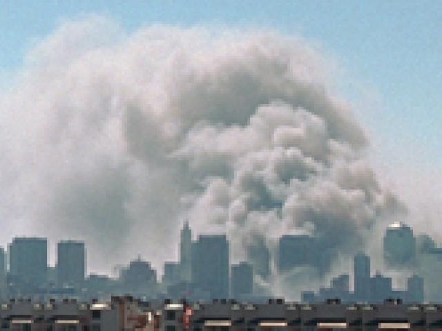 Smoke rises from the site of the World Trade Center, September 11, 2001.
