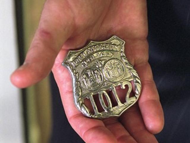 The badge of George Howard, a New York Port Authority police officer who perished on 9/11 while assisting others.