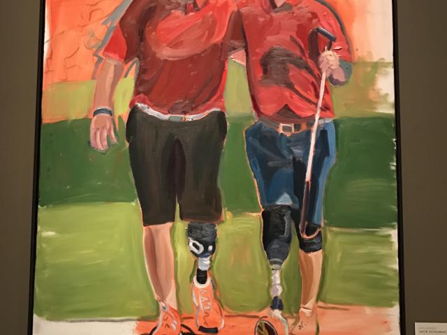 A photo of a portrait of Jack Schumacher and a companion by President George W Bush, part of the  2017 exhibit Portraits of Courage, at the George W Bush Library and Museum