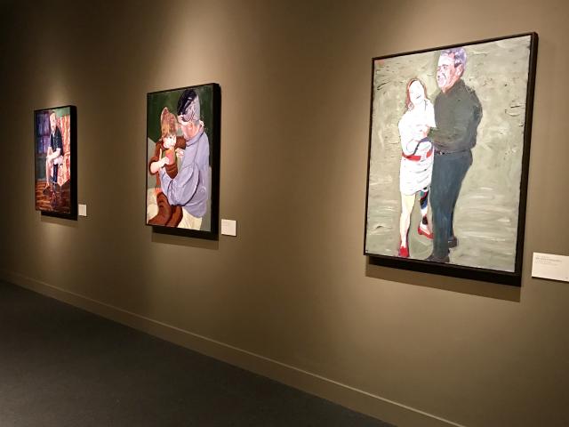 A photo of three portraits painted by President George W Bush, on a wall of the 2017 exhibit Portraits of Courage, at the George W Bush Library and Museum