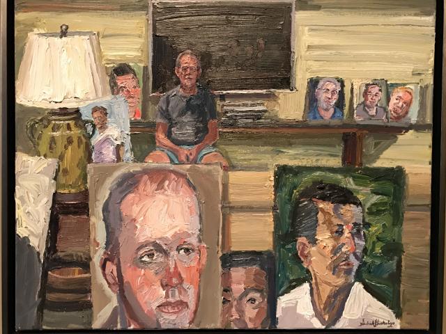 A photo of a painting that a features an array of painted portraits, part of the 2017 exhibit Portraits of Courage, at the George W Bush Library and Museum 