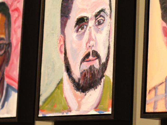 A photo of a portrait of Andy Hatcher by President George W Bush, part of the 2017 exhibit Portraits of Courage, at the George W Bush Library and Museum