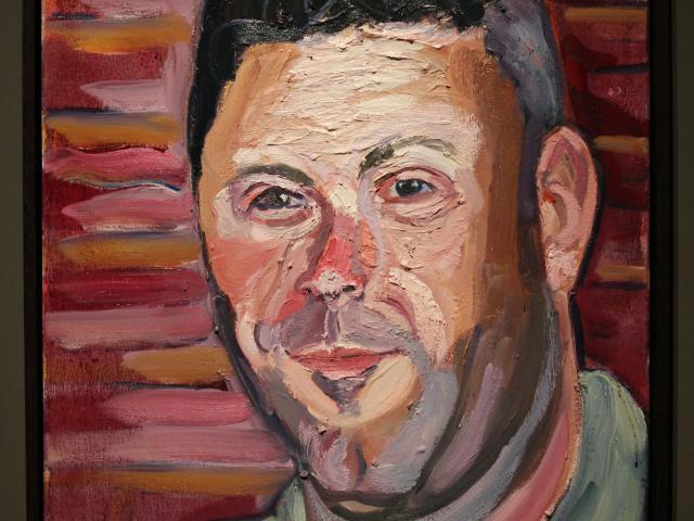 A photo of a portrait of Matthew Ayers, painted by President George W Bush, part of the 2017 exhibit Portraits of Courage, at the George W Bush Library and Museum