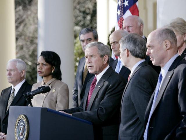 President George W. Bush addresses reporters about the proposed balanced budget and earmark reform as he stands with members of his Cabinent in the Rose Garden at the White House on January 3, 2007.