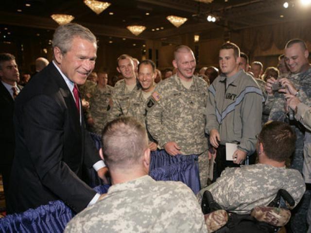 President George W. Bush is greeted by military personnel following his address on the global war on terror at the Military Officers Association of America meeting at the Capital Hilton Hotel in Washington, D.C., on September 5, 2006.