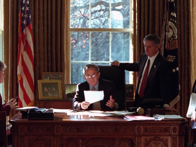 President George W. Bush meets with Andy Card, Karl Rove, and Karen Hughes in the Oval Office of the White House on December 20, 2001.