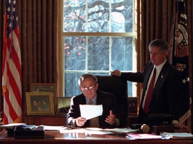 President George W. Bush meets with Andy Card, Karl Rove, and Karen Hughes in the Oval Office of the White House on December 20, 2001.