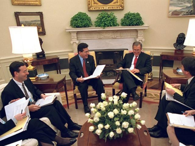 President George W. Bush meets with staff in Oval Office on March 28, 2001.