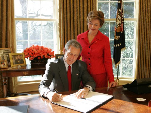 President George W. Bush Signs a Proclamation Designating February as American Heart Month in the Oval Office on February 1, 2005.