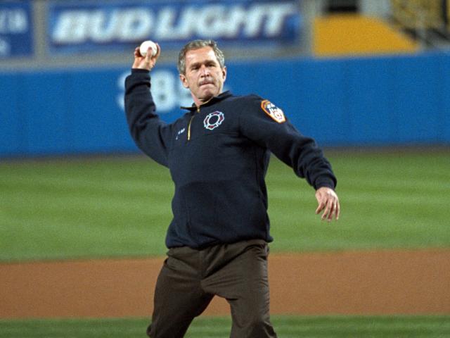 President George W. Bush throws out the ceremonial first pitch at Yankee Stadium before Game Three of the World Series between the Arizona Diamondbacks and the New York Yankees.