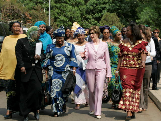 Mrs. Laura Bush Walks with Members of the National Center for Women's Development in Abuja, Nigeria 