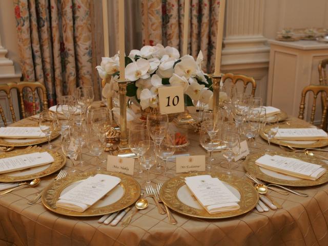 Table settings in the State Dining Room for the White House dinner in honor of the Prince of Wales and Duchess of Cornwall, November 2, 2005.