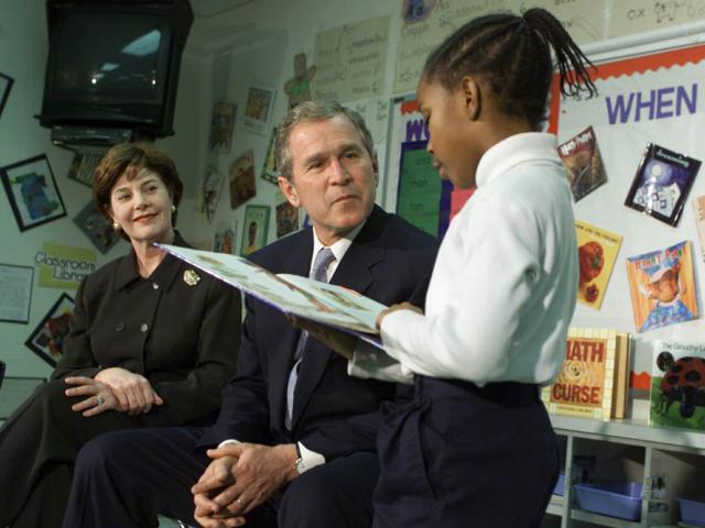 President George W. Bush and Mrs. Laura Bush Listen as Student Janea Bufford Reads Aloud at Moline Elementary School in St. Louis, Missouri