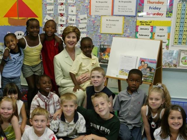 Mrs. Laura Bush poses for a photo with students at Hueytown Elementary School in Birmingham, Alabama, July 14, 2004.