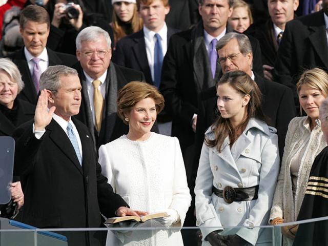 President George W. Bush takes the oath of office to serve a second term as 43rd President of the United States during a ceremony at the U.S. Capitol. Laura Bush, Barbara Bush, and Jenna Bush listen as the oath is administered, January 20, 2005.