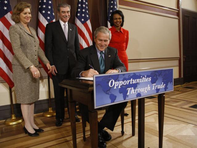 President George W. Bush signs the Andean Trade Preference Act Extension.