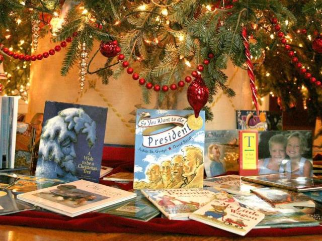 Books underneath Christmas Tree